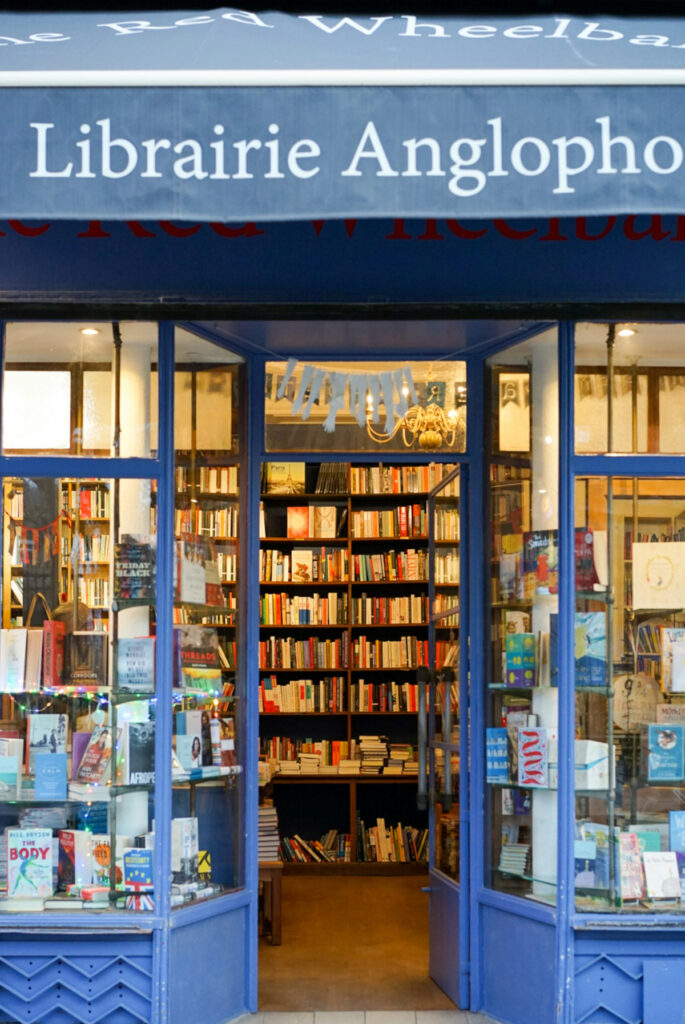 Blue facade of The Red Wheelbarrow bookstore in Paris