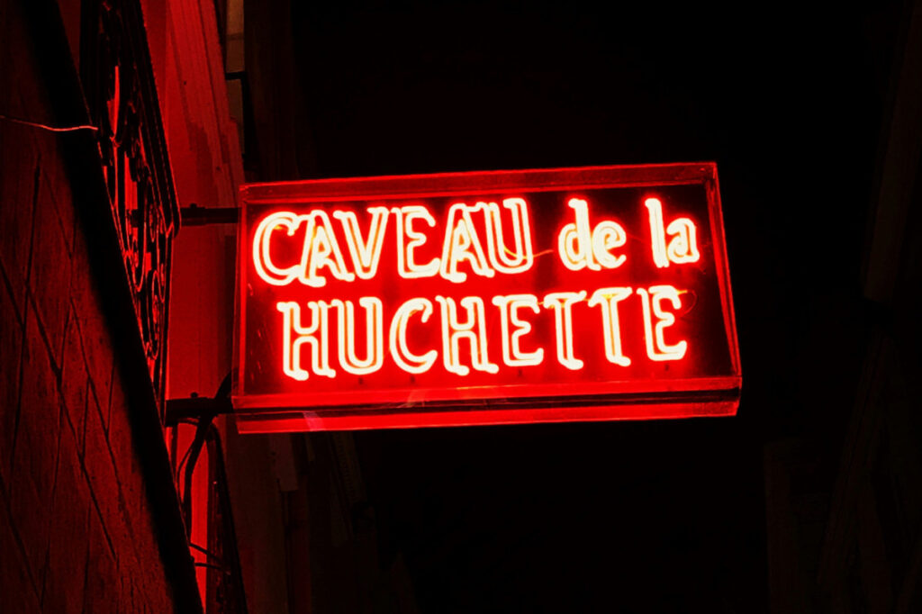 Neon sign of the Caveau de la Huchette in Rue de la Huchette in Paris