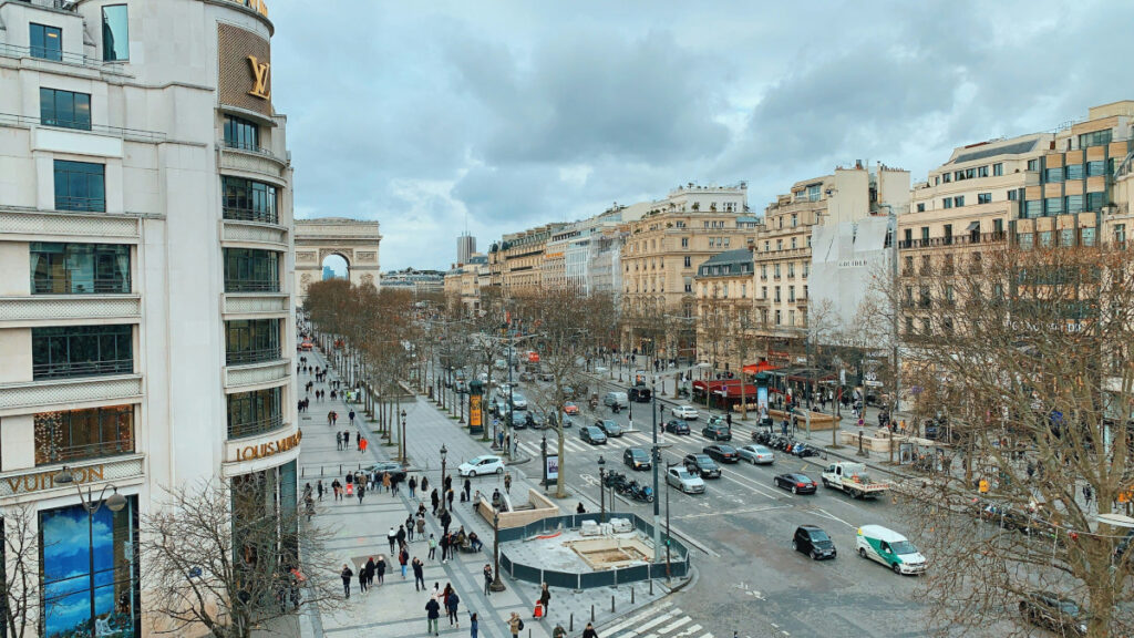 Iconic Champs-&Eacute;lys&eacute;es boulevard with shops and trees in Paris